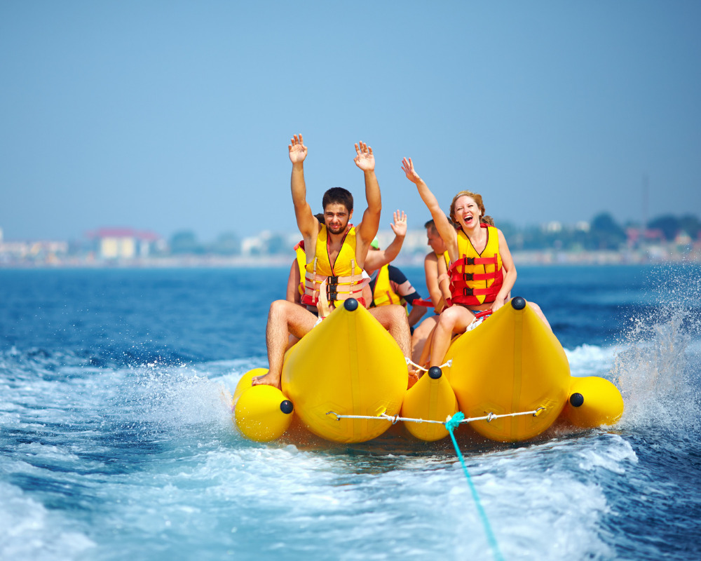 Travelers enjoying a banana boat ride