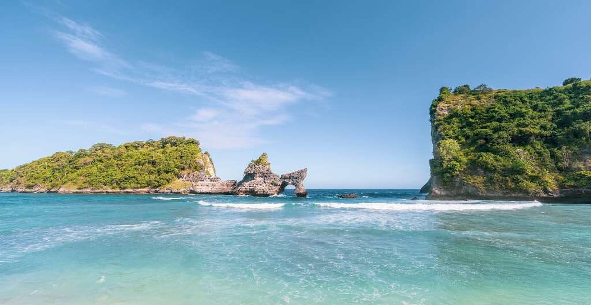 Travelers overlooking the east coast of Nusa Penida
